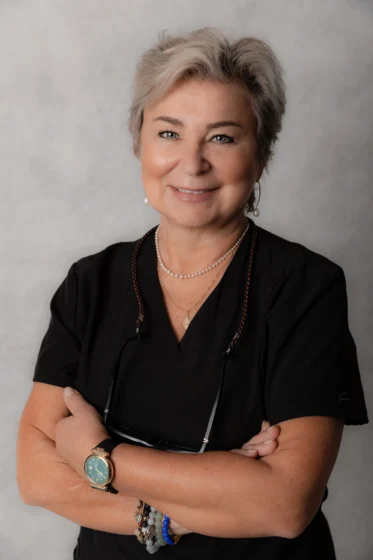 Dr. Sekunda from Six Point Dental on grey background