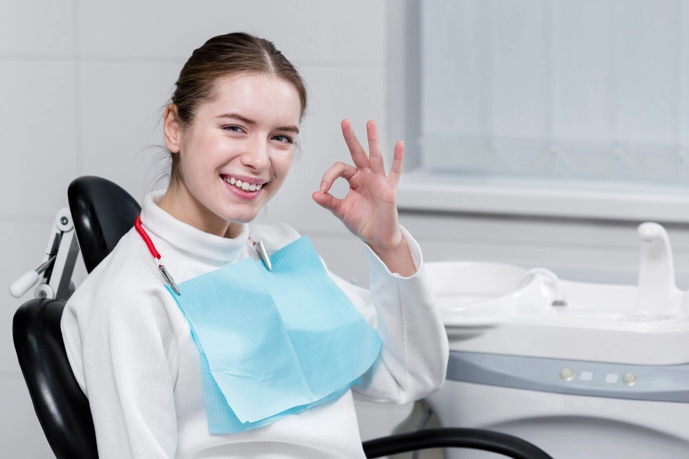 Beautiful woman happy at the dentist
