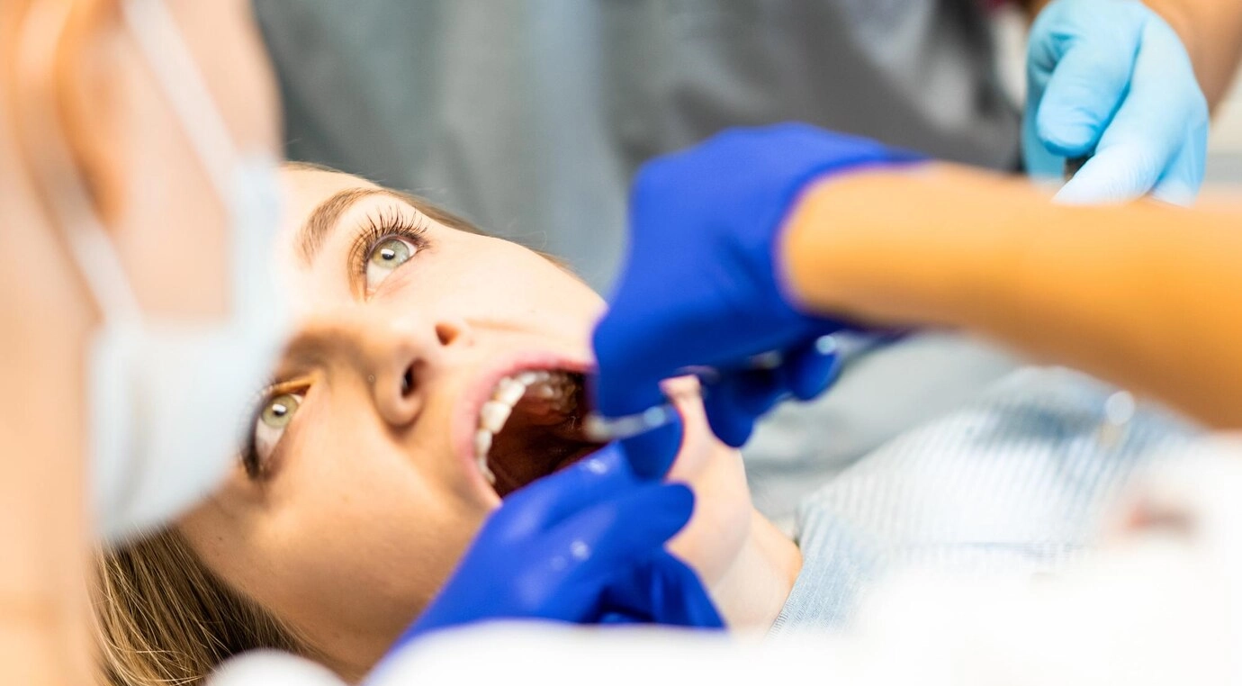 Dentist in the process. Dental services, dental office, dental treatment.