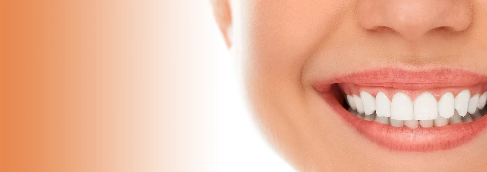 Close-up of a smiling mouth with bright white teeth against an orange gradient background.